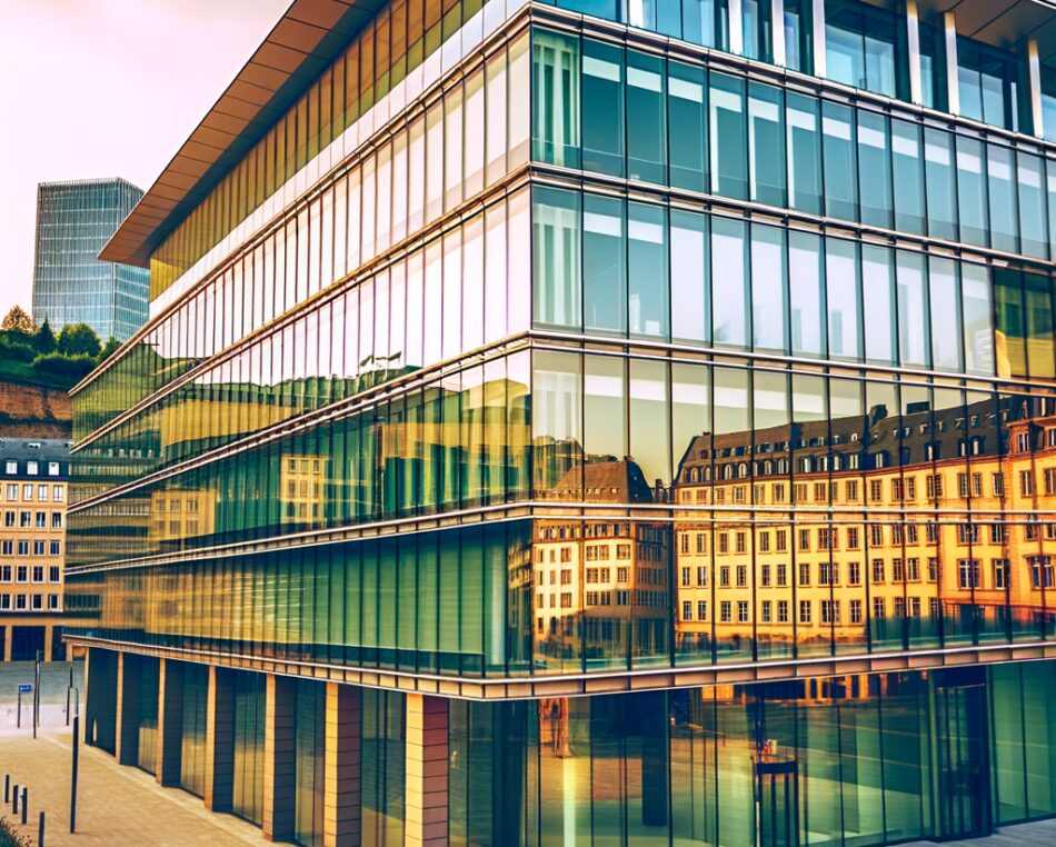 Modern office building in Luxembourg's financial district at sunset